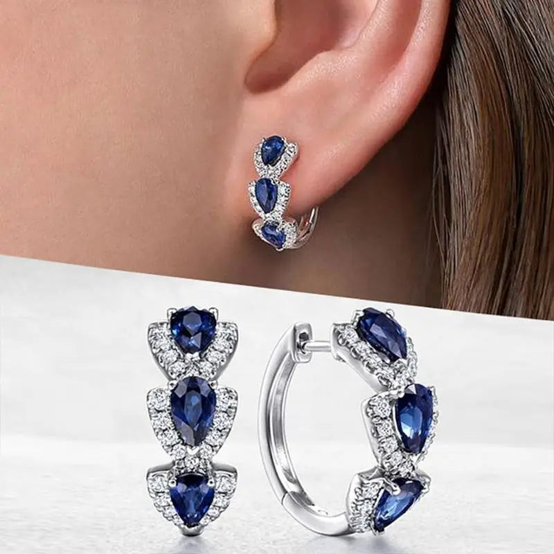 Royal Zafiro Crest Aretes | Blanco Oro